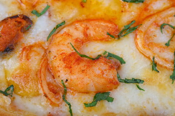 Pizza with mushrooms, sausage and olives on a wooden background