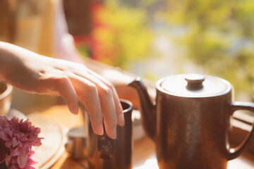 asia culture with set of classic tea cup and jar on wood table for breakfast time in modern hotel on summer travel