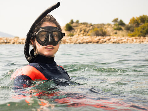 Girl snorkeling in the sea