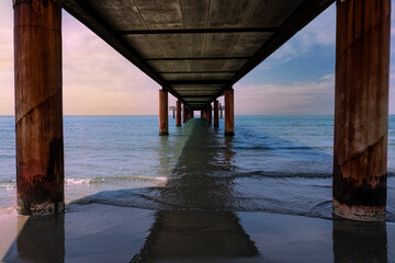 frontal perspective of the pier of forte dei marmi at sunset