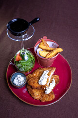 chicken nuggets with sauce and potatoes. Beautiful serving of the dish in cafe