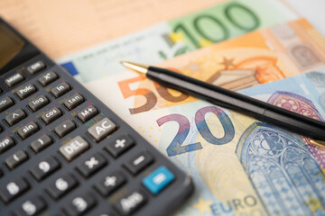 Euro banknotes money with calculator on chart graph paper. Financial development, Banking Account, Statistics, Investment Analytic research data economy, trading, Business company concept.