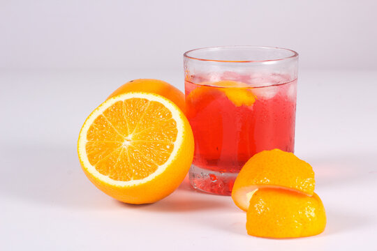Cocktail drink-orange juice fresh juice with strawberry with lemon orange, apple, grapes isolated on white background. High-resolution image