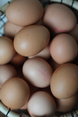 closeup of multiple eggs in a basket