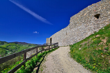 Fototapeta na wymiar Ruins of medieval castle on the hill in spring sunny day, RYTRO, POLAND