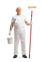 Full length portrait of a mature house painter holding a bucket and a paint roller
