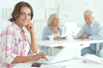 beautiful young businesswoman working in office