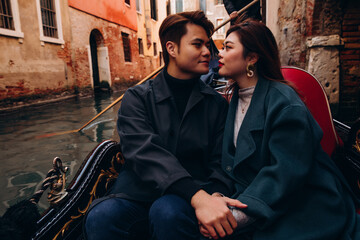 A romantic ride for a guy and a girl on a gondola through the canals of Venice. A young couple travels to Italy.