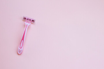Pink woman razor on pink background. pink shaver . smooth body skin