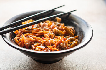 Shirataki noodles rice wok funchose vegetables soy sauce soup pho, pho bo pad thai vegan or vegetarian food trend meal snack copy space food background rustic. top view