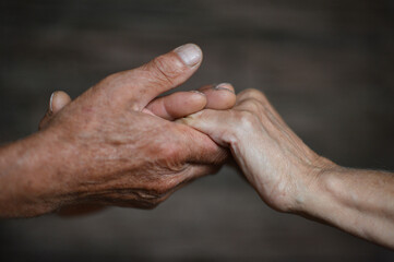 Fototapeta premium granddaughter and grandfather holding hands