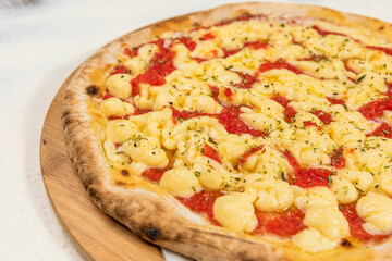 Catupiry Cheese Pizza Homemade Artesanale Close Up Detail on a Round Wooden Plate with Flour Background Table