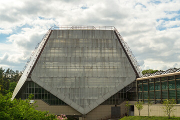 Facade of a large greenhouse for the cultivation of ornamental plants in botanical garden