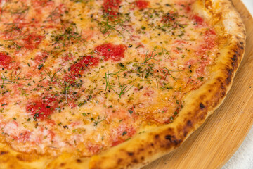 Pizza Homemade Artesanale Close Up Detail on a Round Wooden Plate with Flour Background Table
