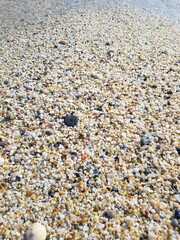 The coastline of Cleopatra Beach. Sea sand in the form of small crushed pebbles. Alanya, Turkey