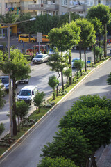 Fototapeta na wymiar View of Mehmet Akif Ersoy city street in Alanya, Turkey. Urban traffic in Turkey