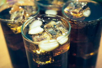 Refreshing Bubbly Soda Pop with Ice Cubes. Cold soda iced drink in a glasses - Selective focus, shallow DOF	
