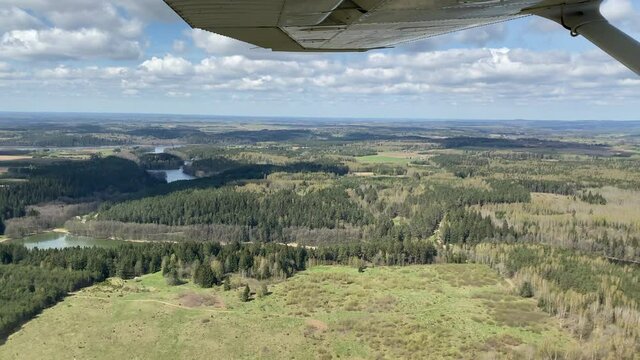 View from Cessna aircraft: lakes, forests and fields of Trakai region, Lithuania