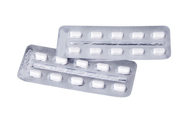 White medical pills in blister pack isolated on white background with clipping path