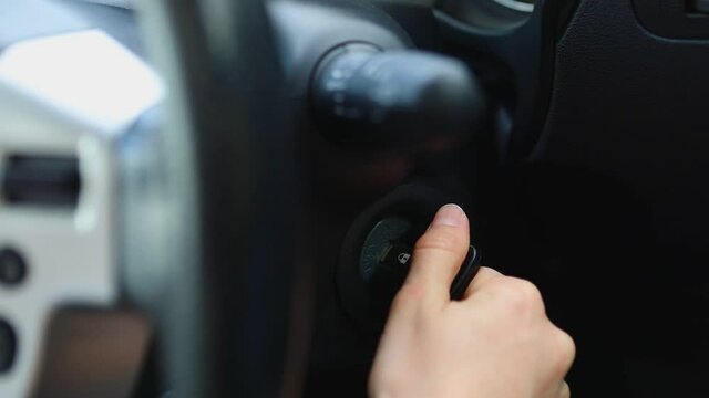 woman hand start car engine