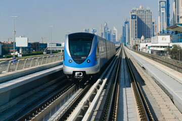 Fototapeta premium United Arab Emirates, Dubai automatic metro seen from a metro in reverse