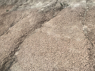 Texture of dry, cracked ground at Badlands National Park, South Dakota.