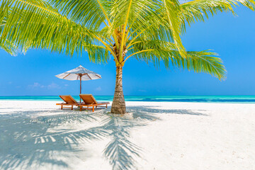Beautiful tropical island scenery, two sun beds, loungers, umbrella under palm tree. White sand,...