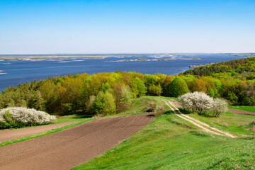 Spring on the slopes of the river. Springtime scenery of the river. Landscape of the river