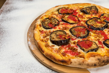 Pizza Aubergine Cheese Rustic Tomate Sauce Homemade Artesanale Close Up Detail on a Round Wooden Plate with Flour Background Table