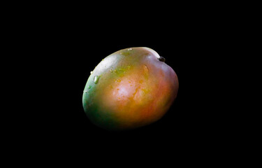 Ripe mango isolated on black background. Mango Clipping Path. Professional studio macro shooting