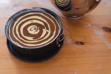 Raw marble sponge cake, ready to be baked. Pastry.