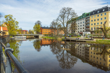 Fototapeta premium Beautiful city landscape view of colorful buildings along river side. Uppsala. Sweden. Europe. 
