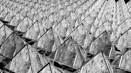 background from rows of black and white cracked pyramids. abstract three-dimensional composition. 3d render illustration