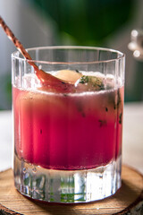 pink elderberry mocktail in a glass