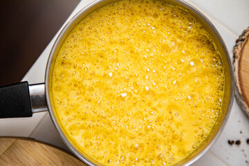 Traditionnal golden latte in a white mug