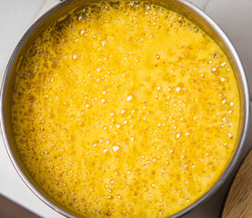 Traditionnal golden latte in a white mug