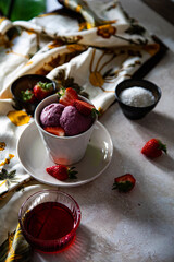 vegan strawberry ice cream with fresh fruits in a cup