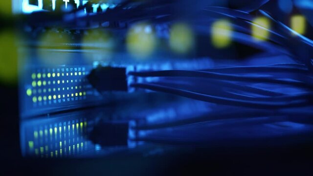 Super computer server racks in datacenter. Concept of big data storage and mining cryptocurrency. Network routers of ISP. Many wires connect to the network interfaces of powerful internet servers