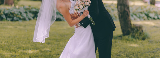 Fototapeta premium stylish bridal couple posing on their wedding day, happy bride and groom together