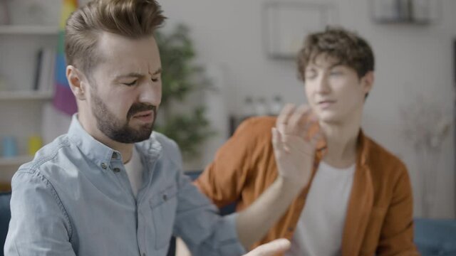 Offended man refusing to talk to boyfriend, conflict in same-sex couple, breakup