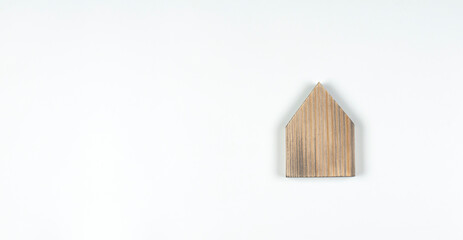 Obraz na płótnie Canvas Miniature model of the house. Wooden house. On white background