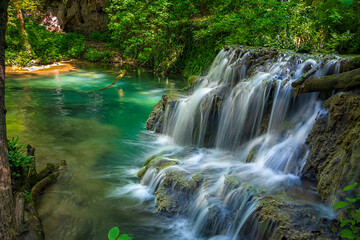 Cascade waterfalls. Krushuna falls in Bulgaria near the village of Krushuna, Letnitsa. - obrazy, fototapety, plakaty