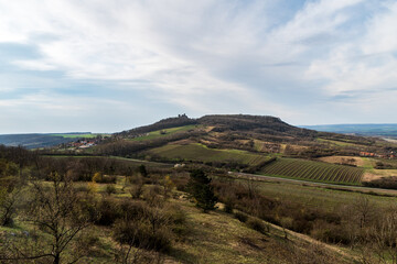 Fototapeta na wymiar Palava mountains with Stolova hora hill, Sirotci hradk castle ruins and Klentnice village in Czech republic