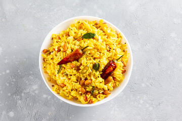 A balti dish with lemon rice, rice flavoured with mustard seeds, curry leaves and green chili in a...