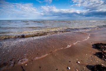 Baltic sea, waves and blue sky in sunny spring day. 