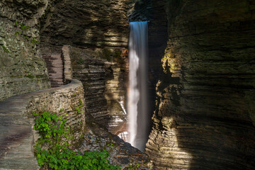 Morning Sunlight on Cavern Cascade Falls Over Gorge Trail Leading To Spiral Tunnel in Watkins Glen State Park