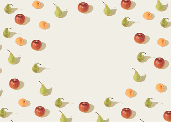 Pattern of apple pears and peaches on a light beige background. Minimal summer layout.
