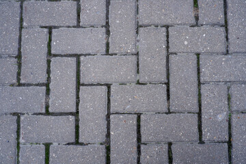 Gray cobbled pavement close up top view