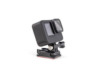 New 4K action camera on a suction mount in black color. Isolated white background
