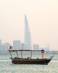 Traditional arabian dhow in the middle of the sea near Manama City.